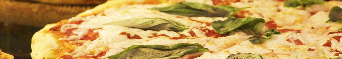 Eating Italian Pizza Sandwich at Tuscana Pizza restaurant in Wasilla, AK.